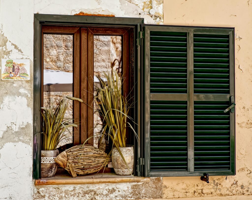 Comparison of cheap plantation shutters and premium plantation shutters showing differences in quality, materials, and design style